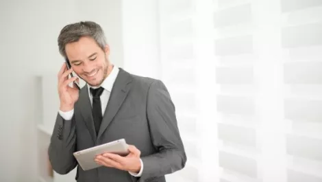 Businessman with tablet and mobile 6
